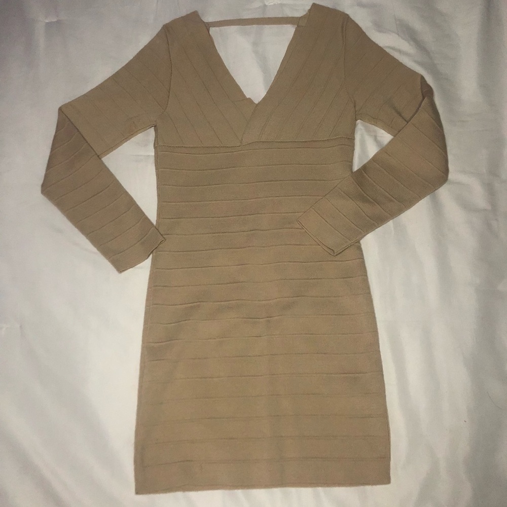 Form fitting mini dresss low back and front it is also long sleeve good material